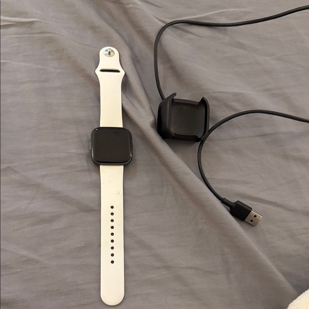 Fitbit Smartwatch with White Band and Black Face